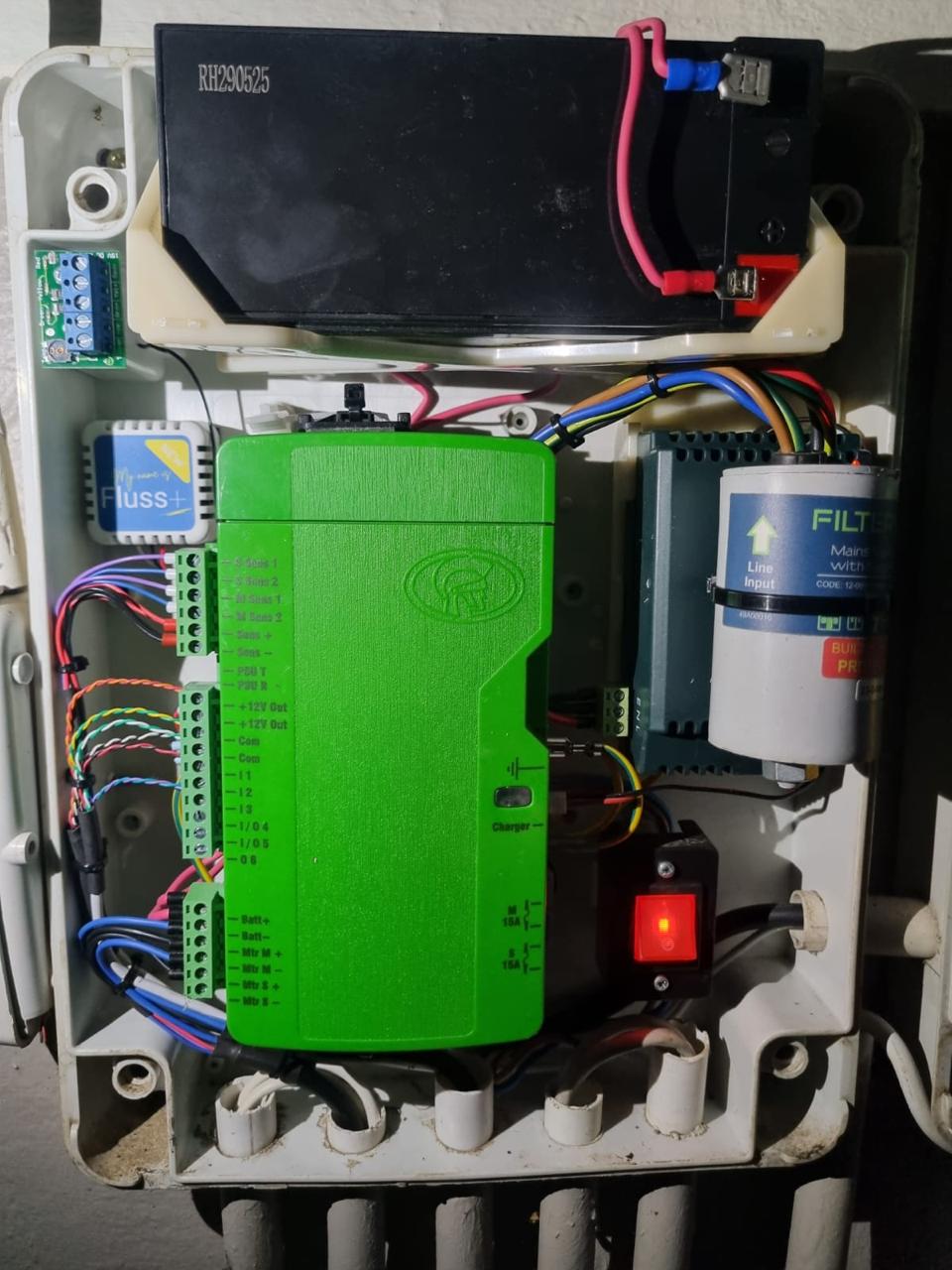 Gate controller board, battery backup and mains filter wired inside an enclosure