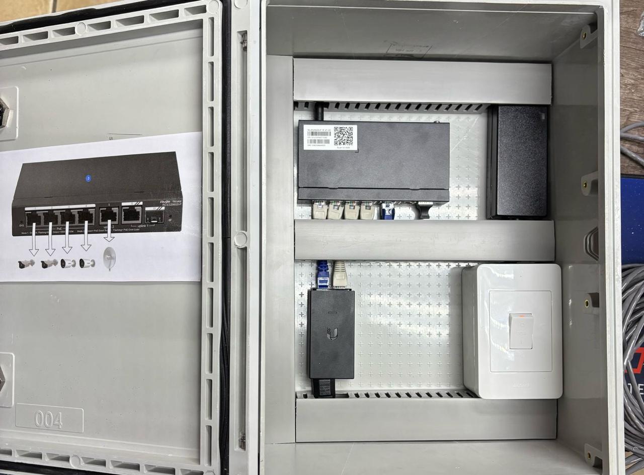Open weatherproof cabinet with network switch, PoE injector and power outlet