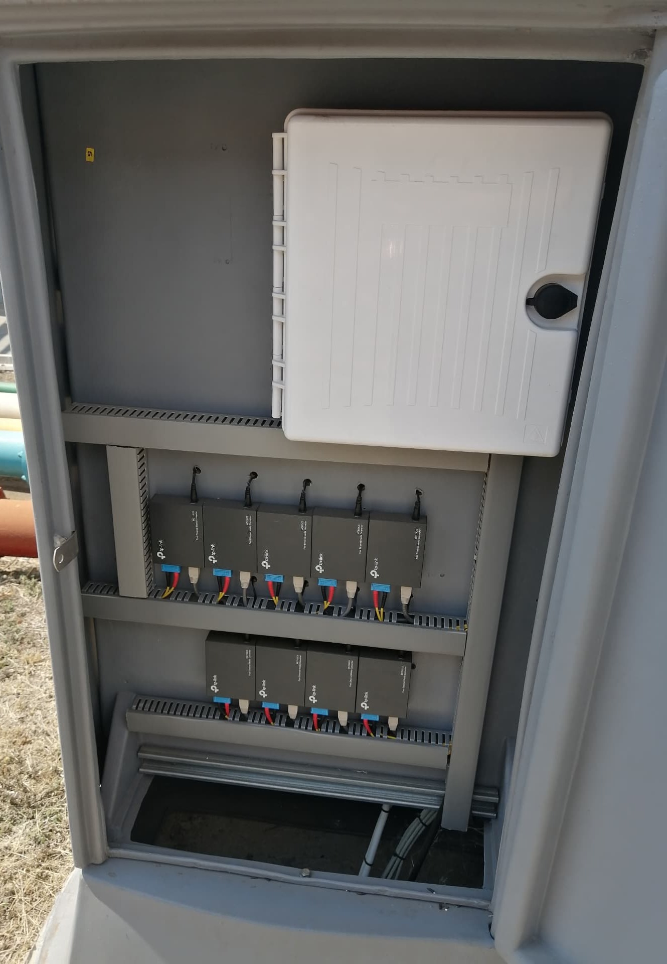 Outdoor CCTV network switches installed inside a weather-protected cabinet