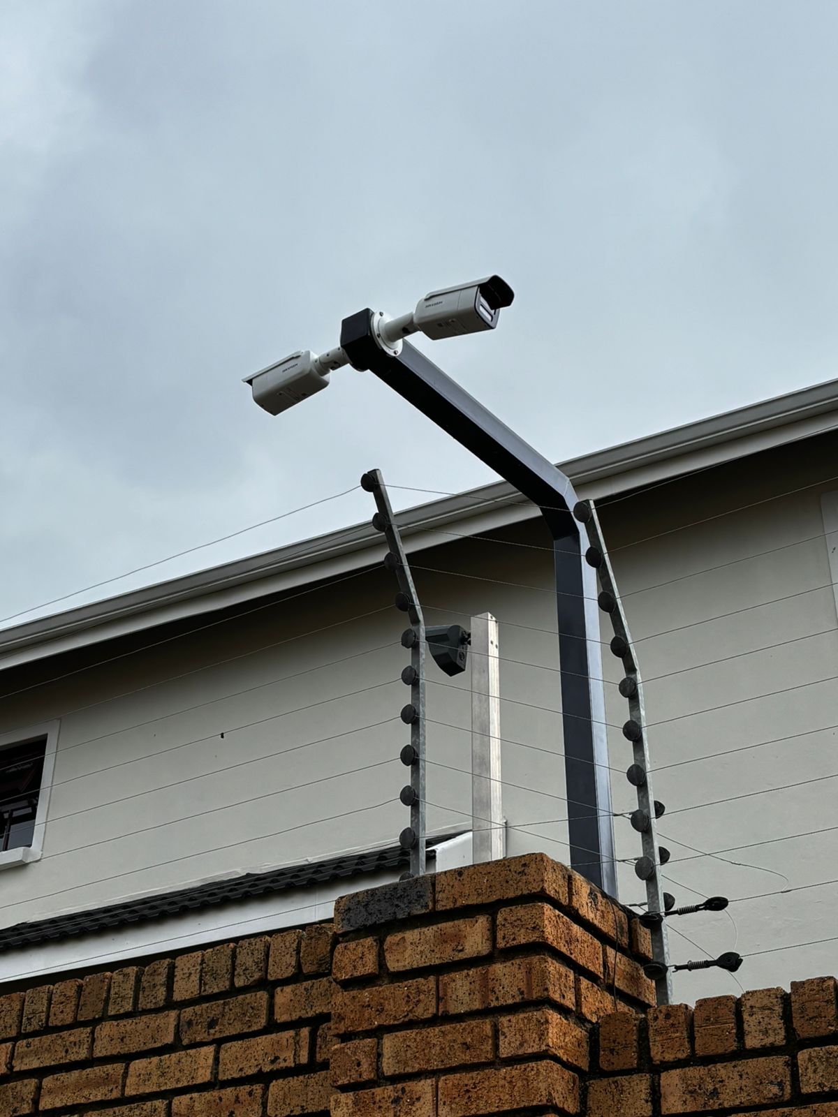 Dual security cameras installed for perimeter surveillance